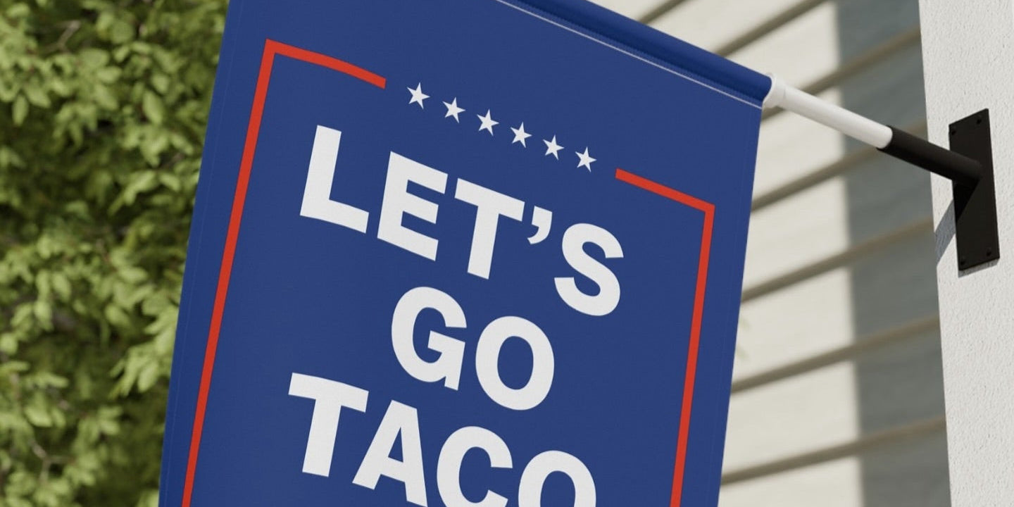 Blue sign with 'Let's Go Taco' text on a building exterior